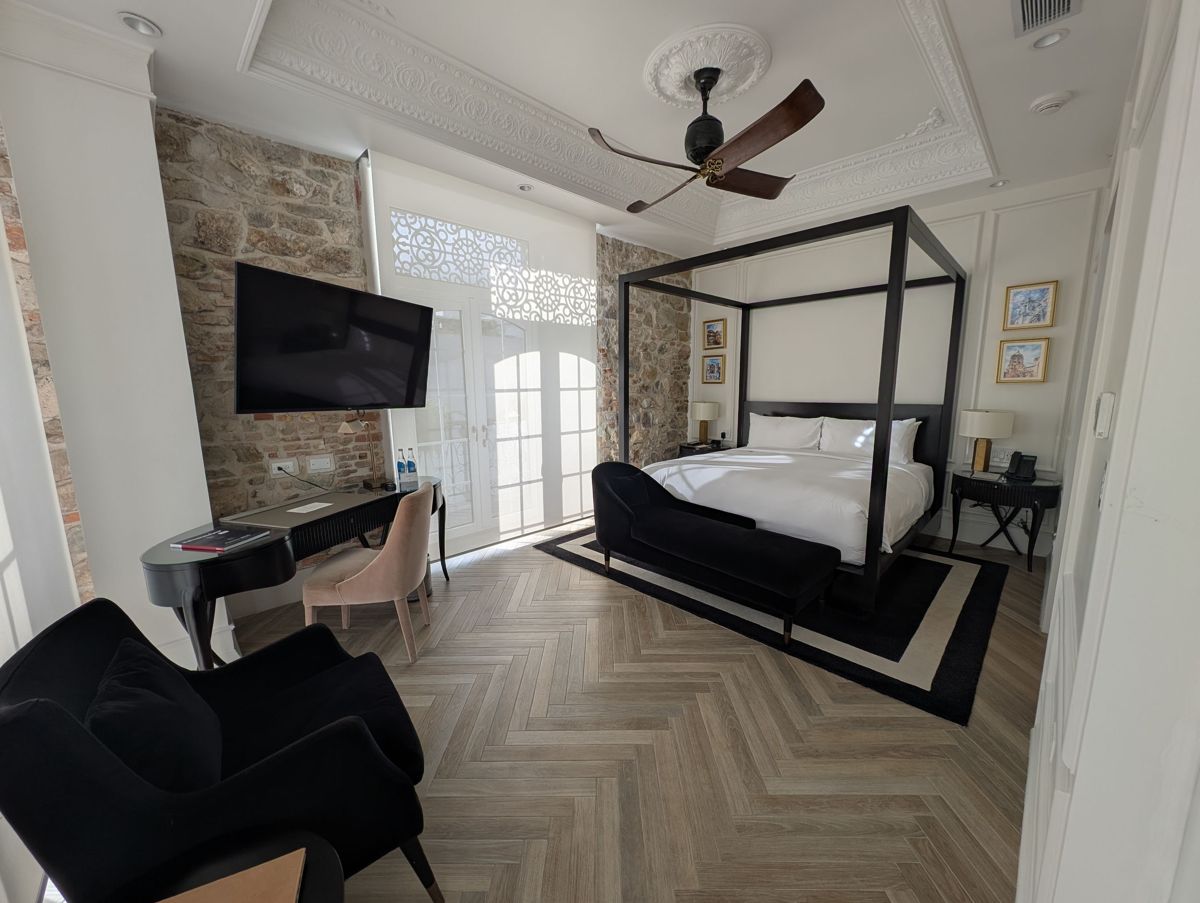 The bedroom: stone walls and a four-poster bed
