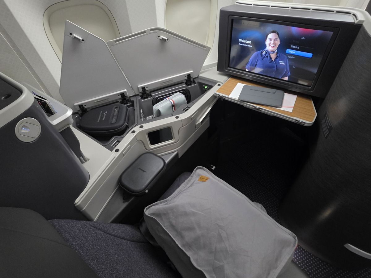 An American Airlines business class seat by the window