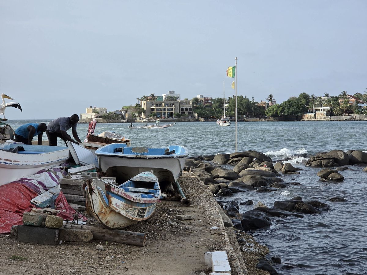 Working on the boats across from Ngor Island