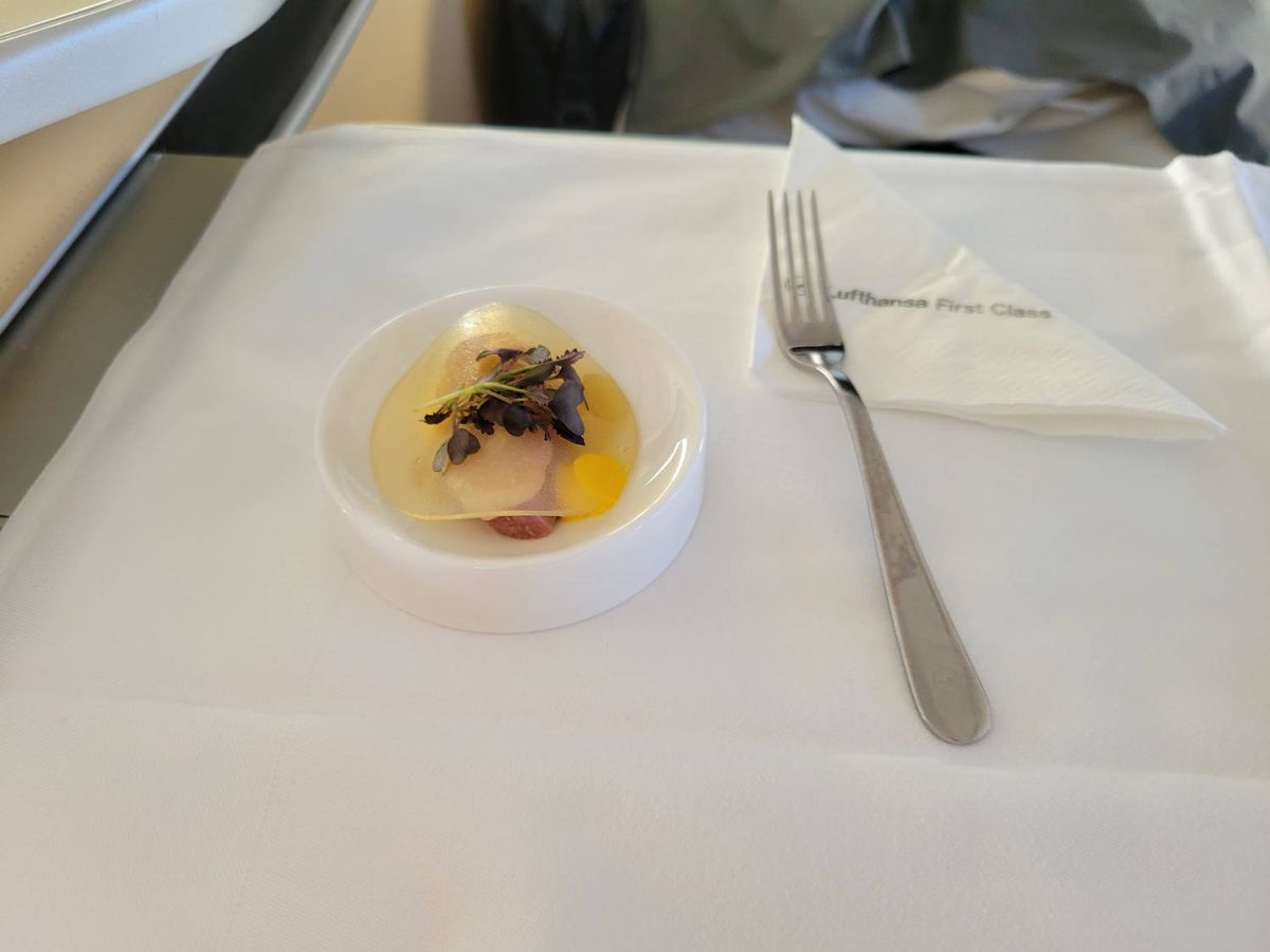 A small first course with herbs and a fork