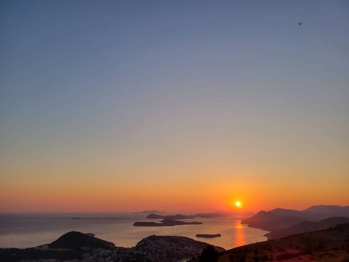 The sun touching the hills