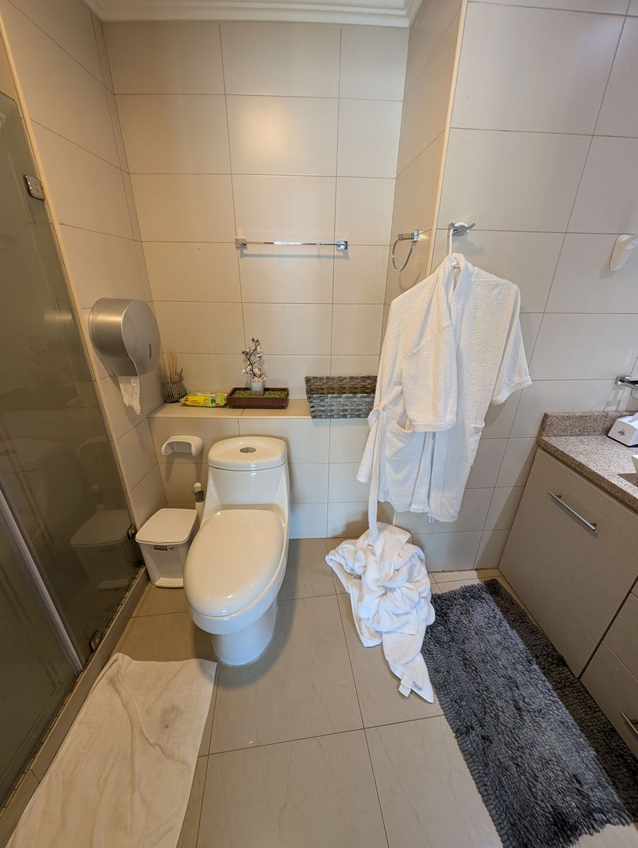 The bathroom, with robes
