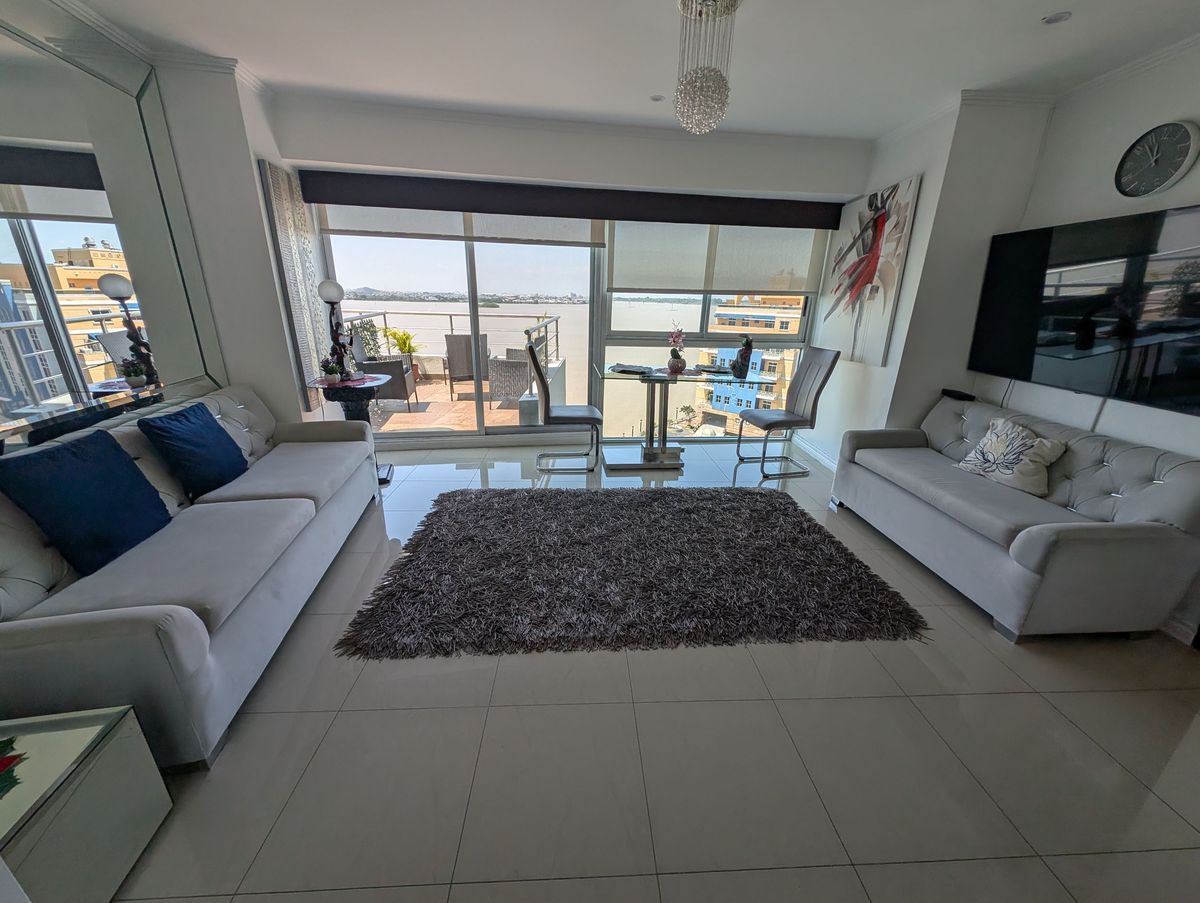The living room, with the balcony and the river beyond
