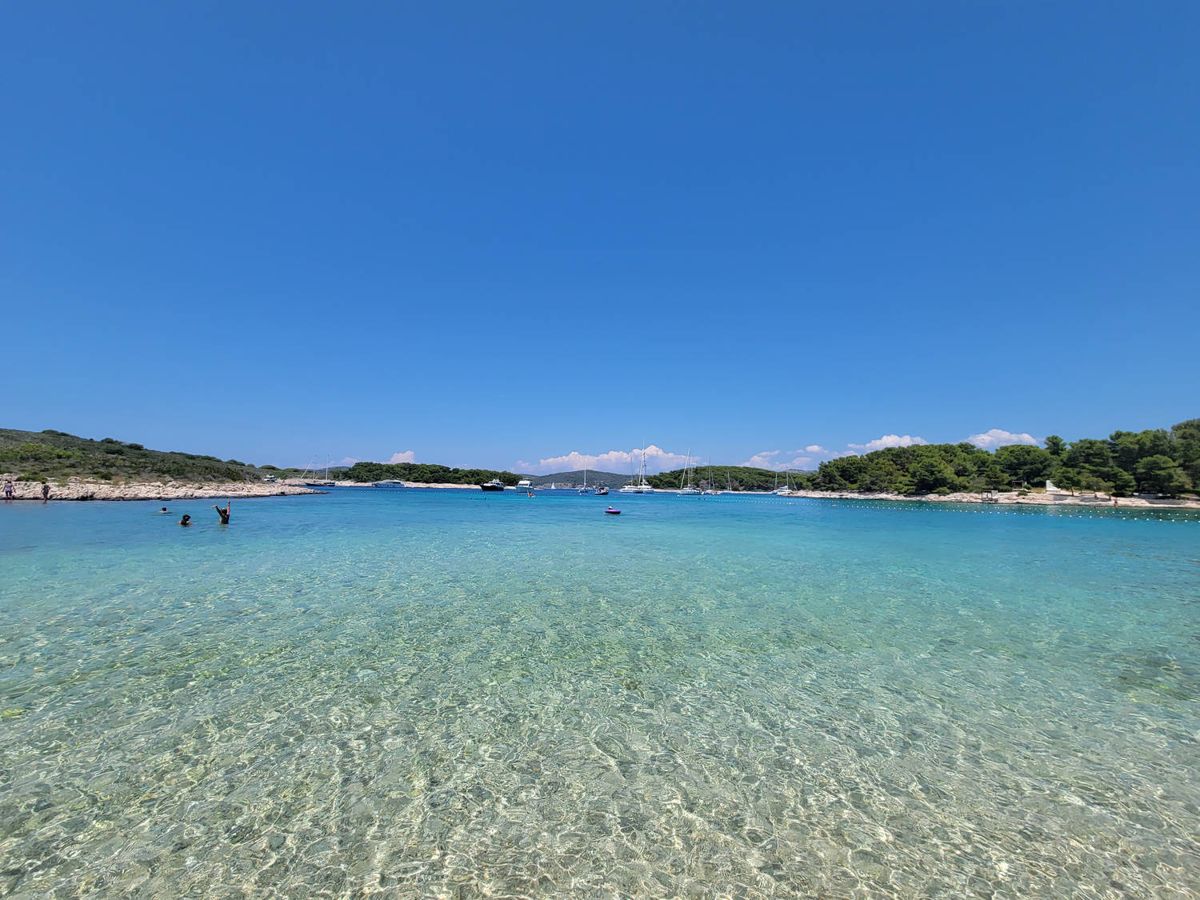 Clear shallow water off a beach