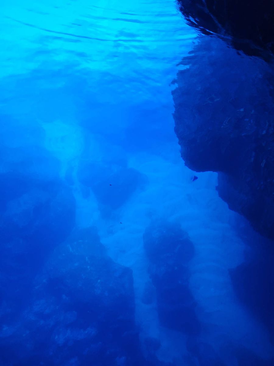 Blue water under the rock