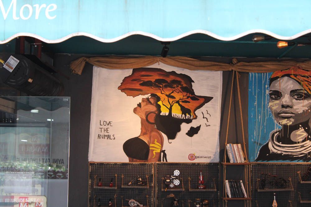 A café window with painted portraits