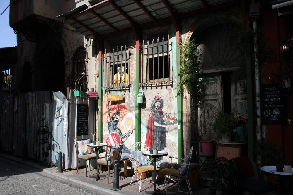 A café front with painted figures