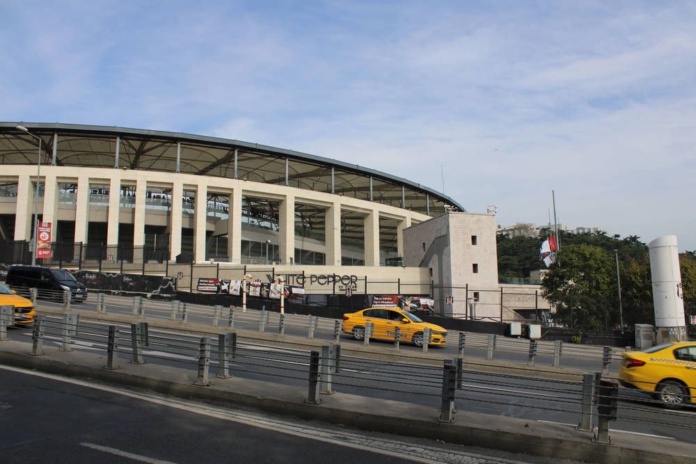 A stadium and yellow taxis