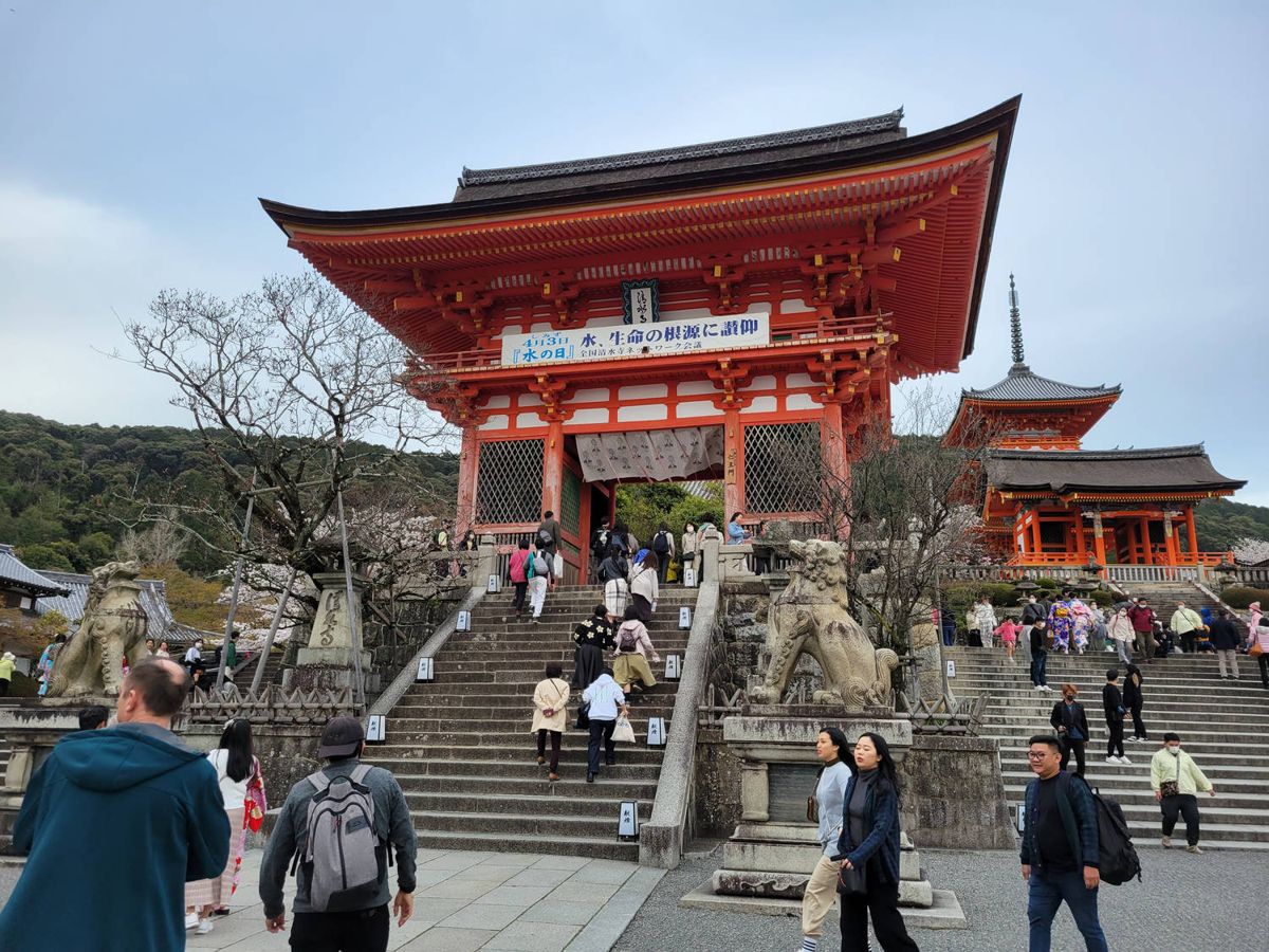 Crowds on the steps to the red temple gate