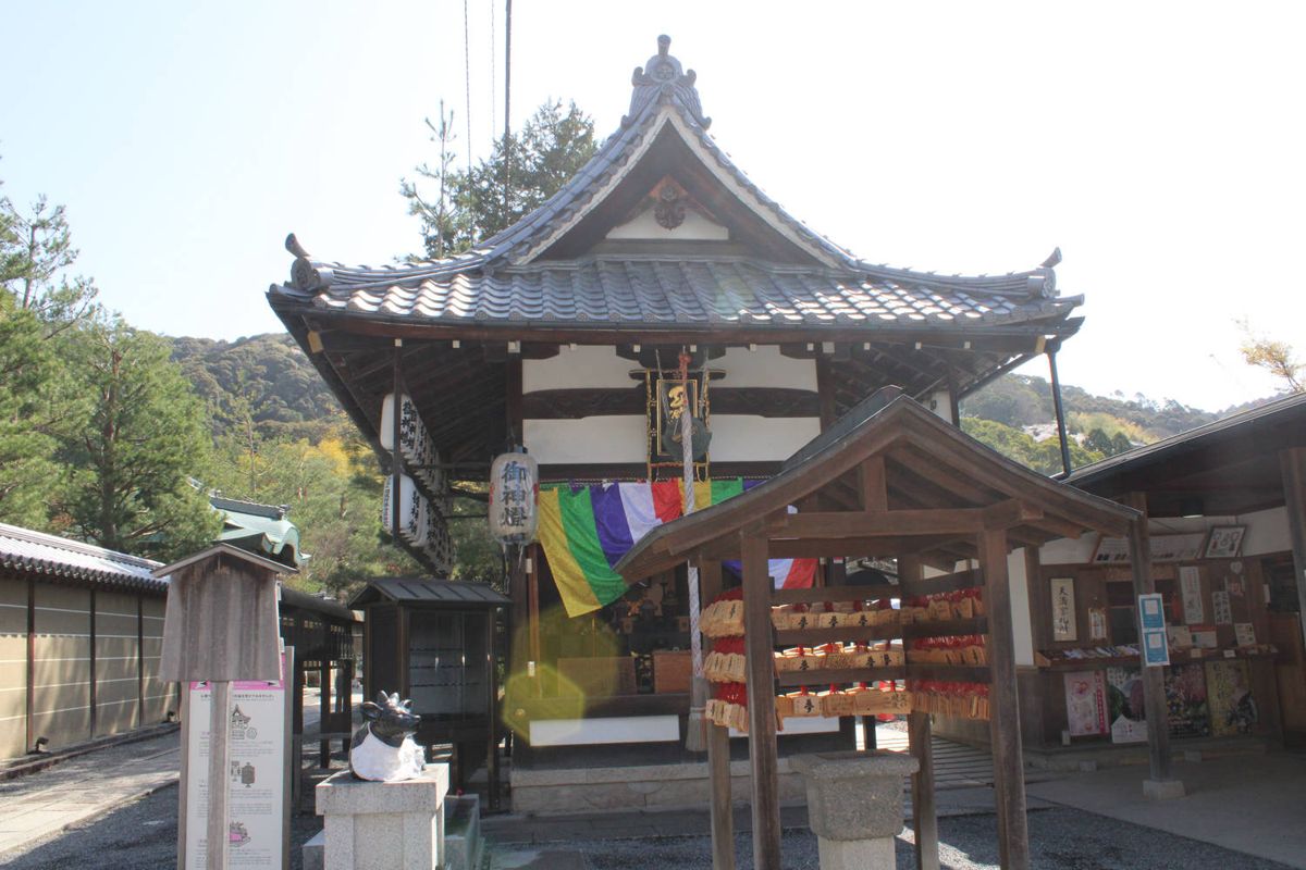 A small temple hall with prayer streamers