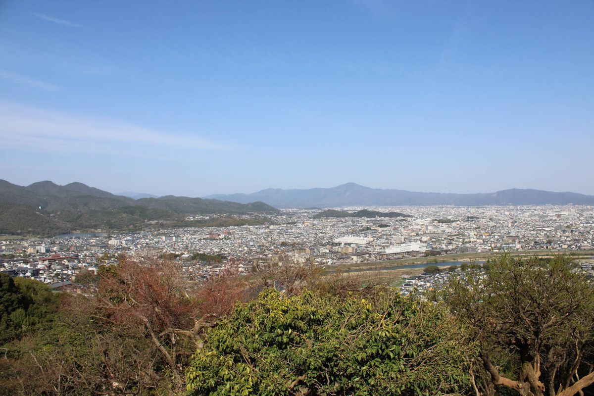 The city spread out below the hill