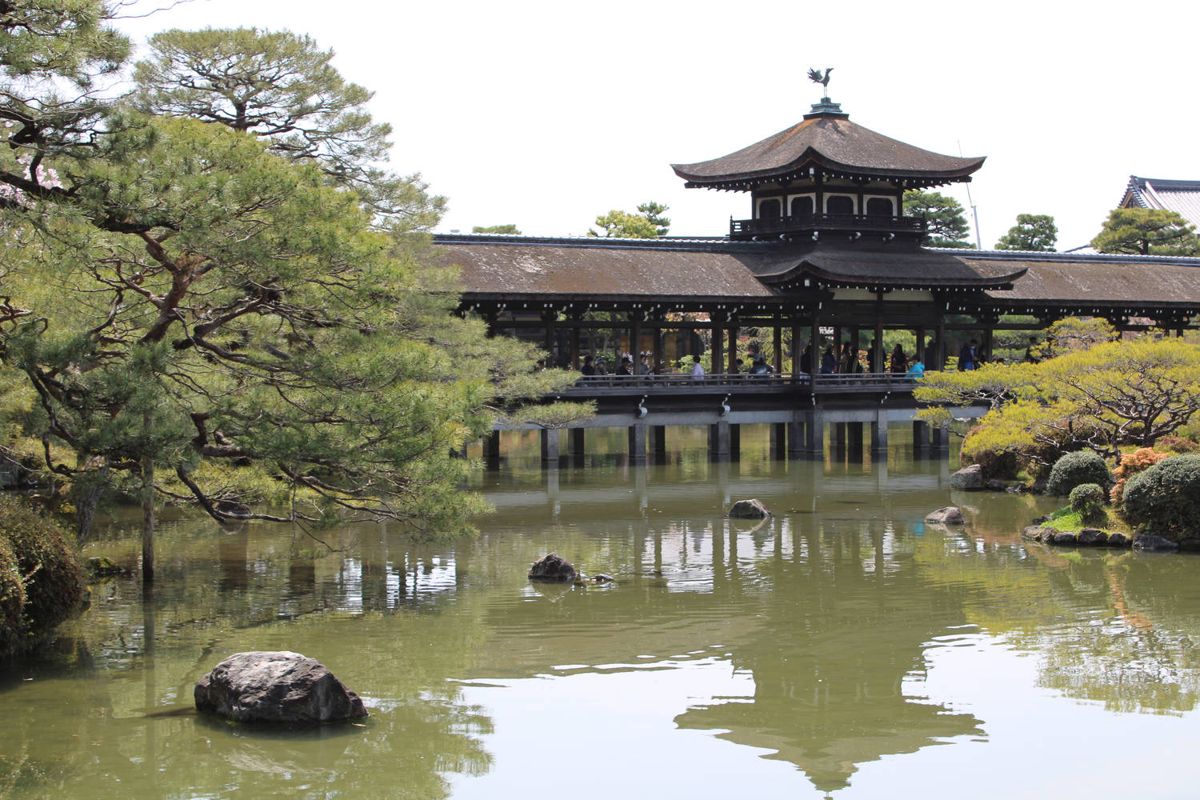 The covered bridge with a pavilion on the pond
