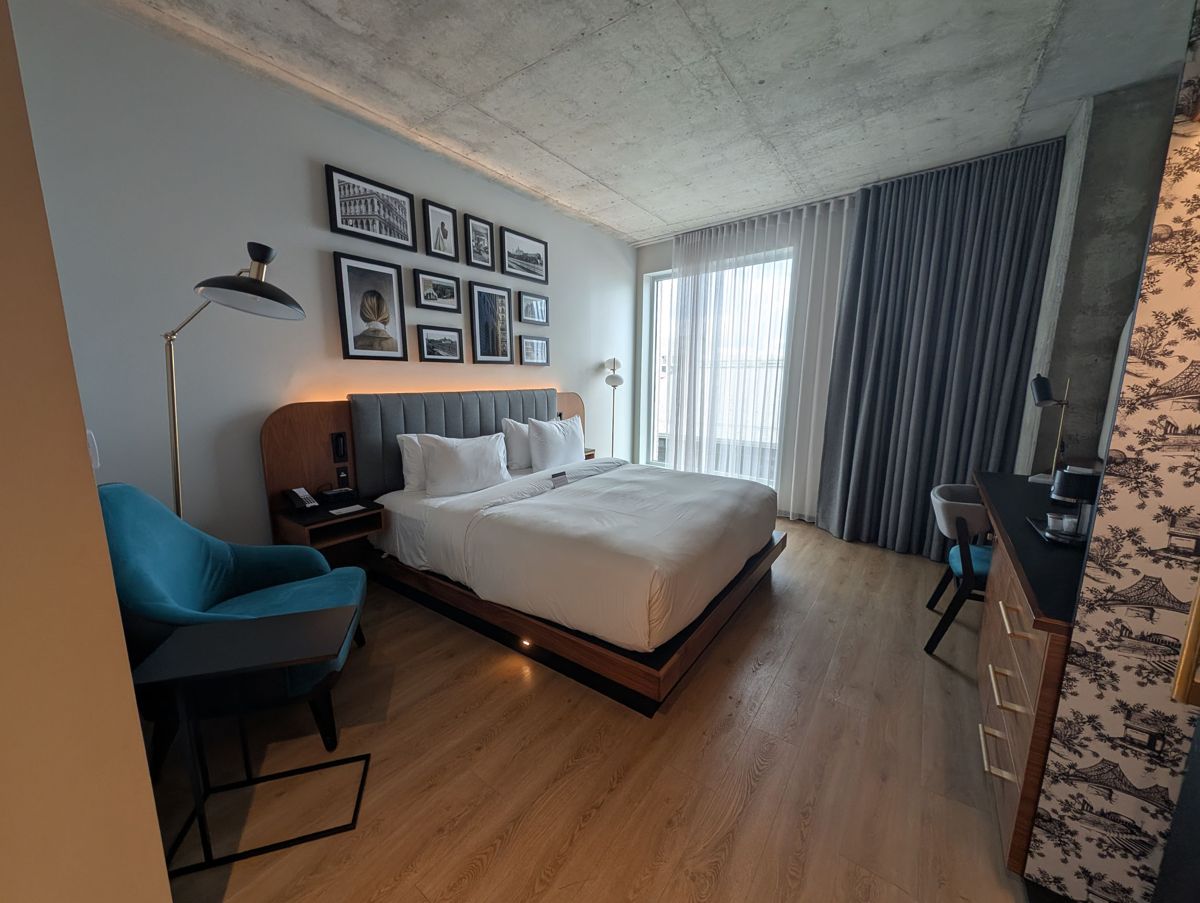 The bedroom, with a gallery wall of old Montreal photos