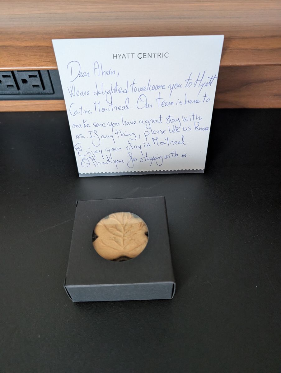 A handwritten welcome and a maple leaf cookie