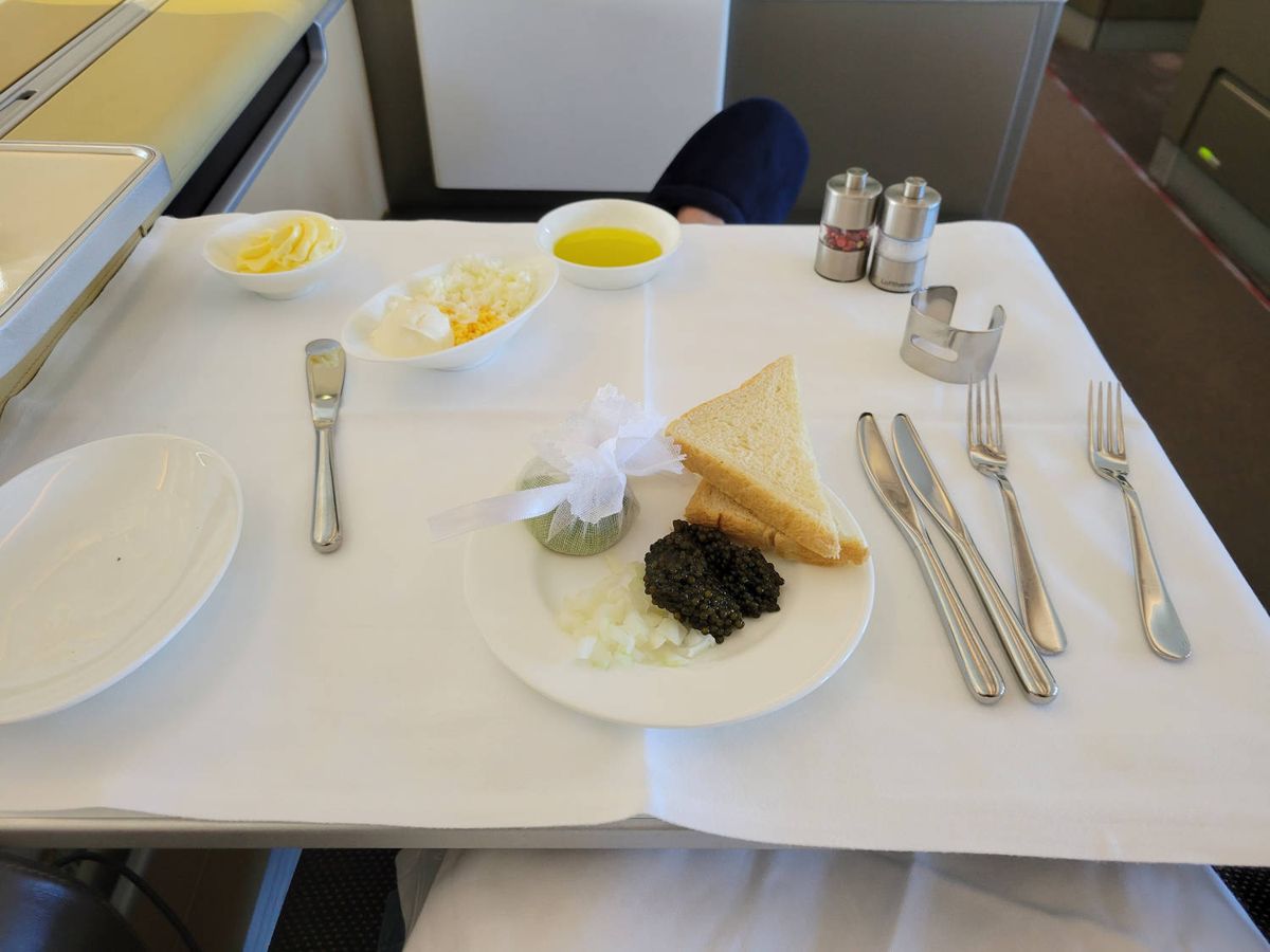 The caviar plate with toast, onion and egg