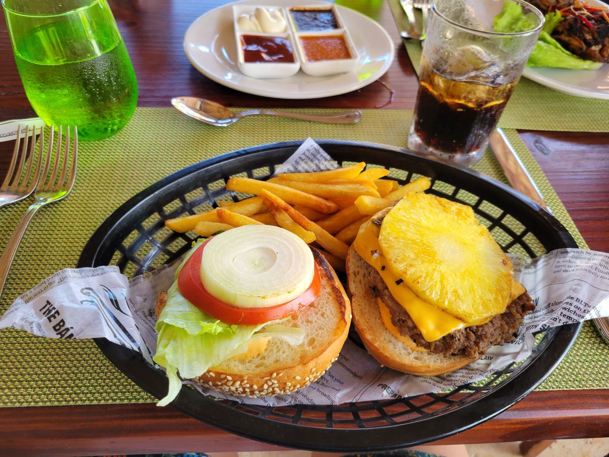 A burger with grilled pineapple