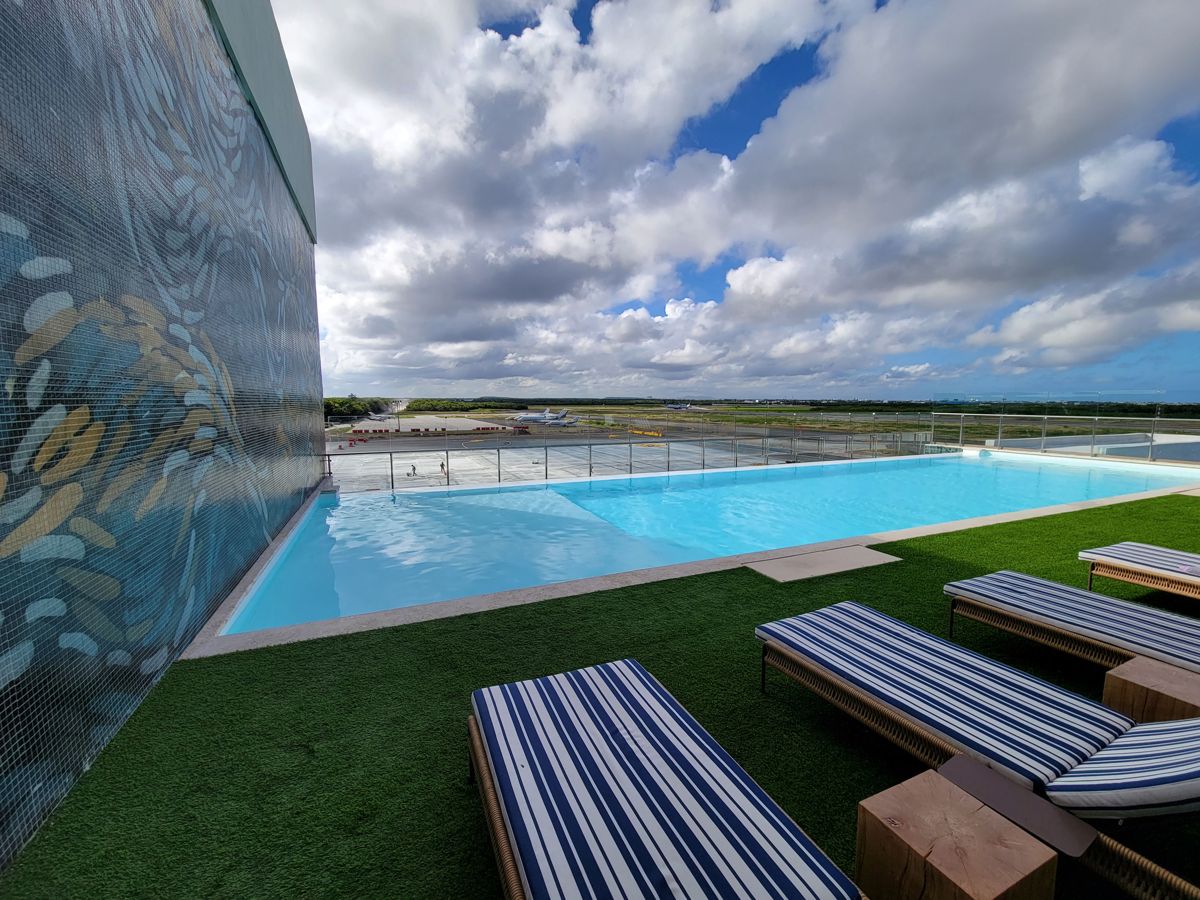 The pool along the mosaic wall