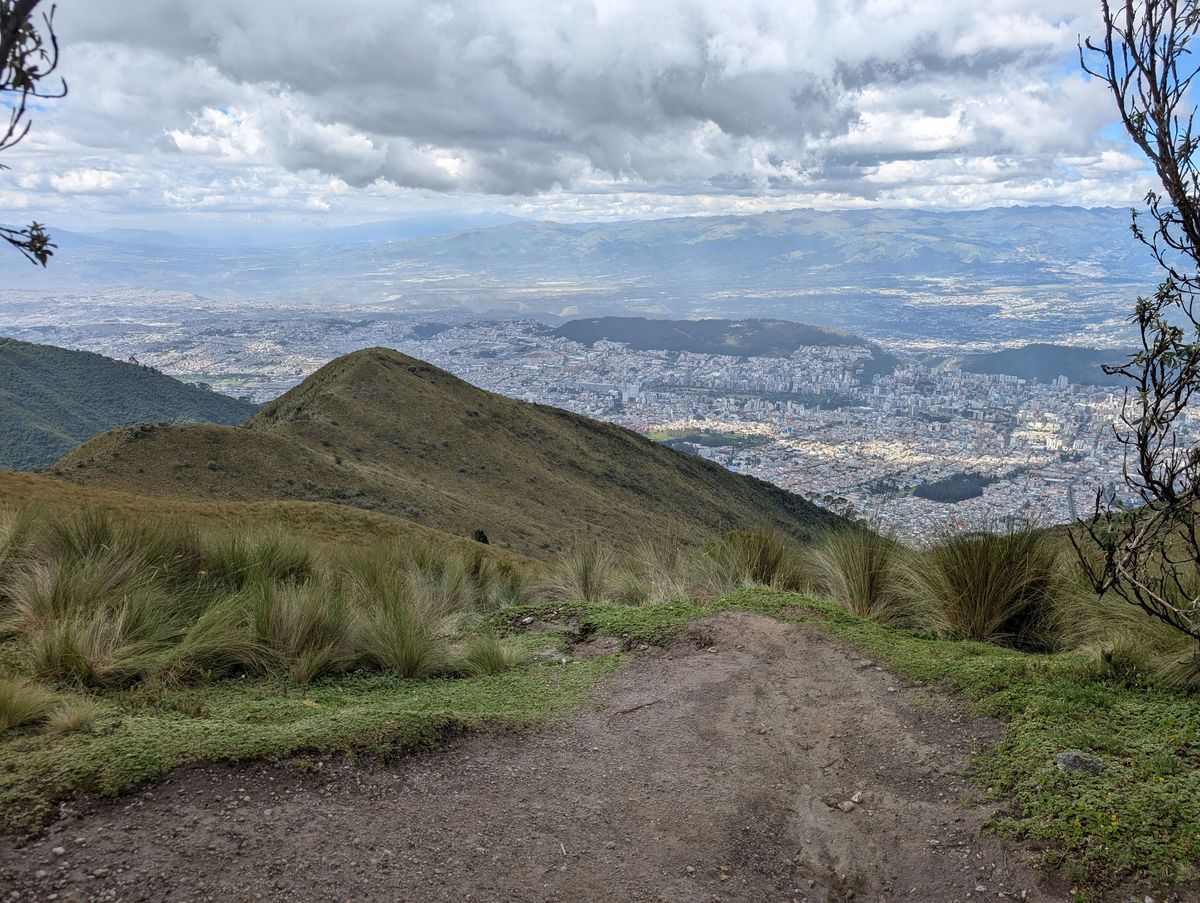 Quito filling the valley, with the Andes beyond