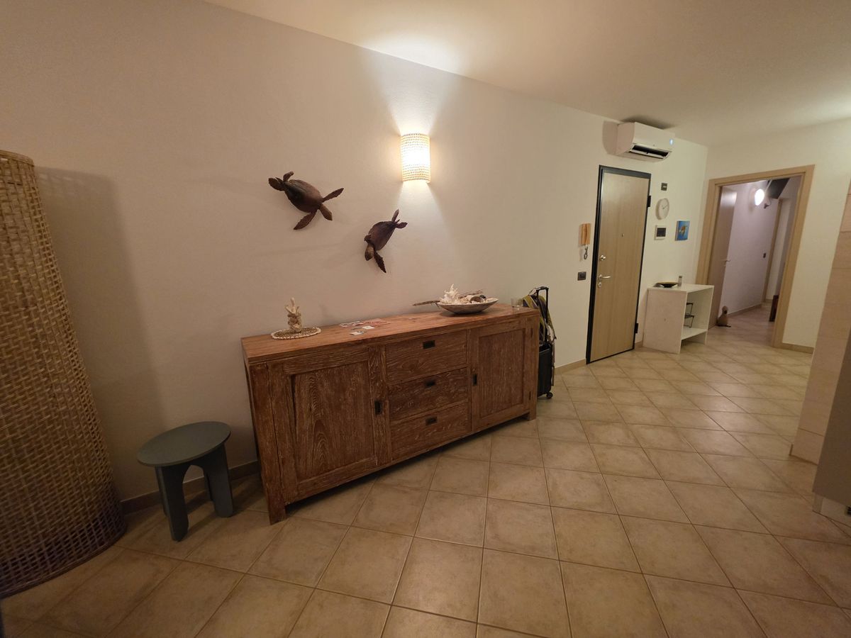 The hall, with wooden sea turtles over the sideboard