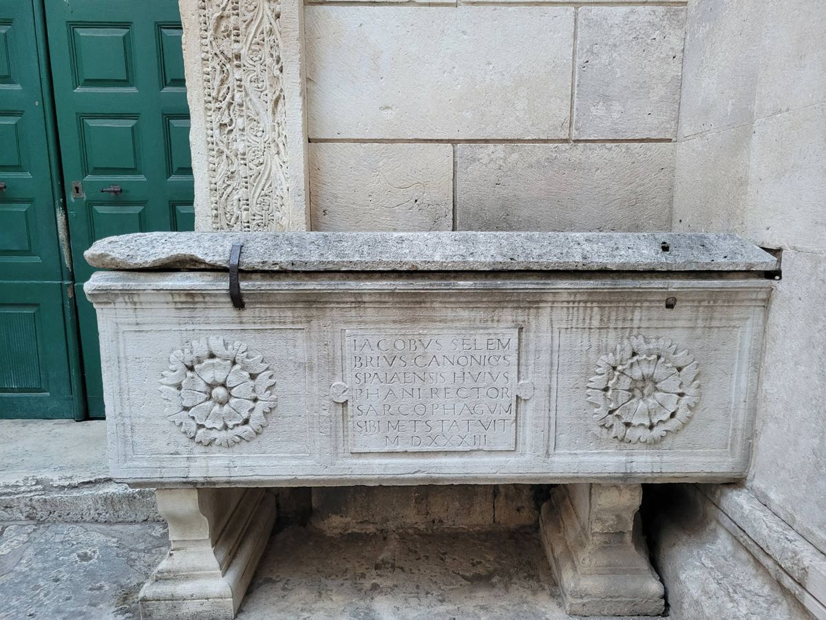 A carved stone sarcophagus