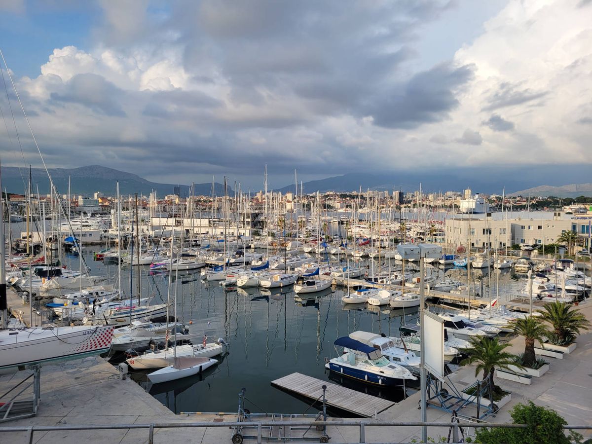 Masts and the city across the bay