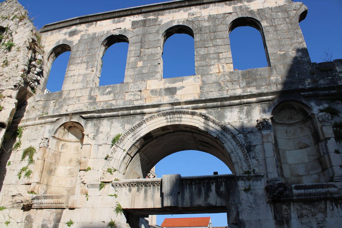 A ruined wall of arches