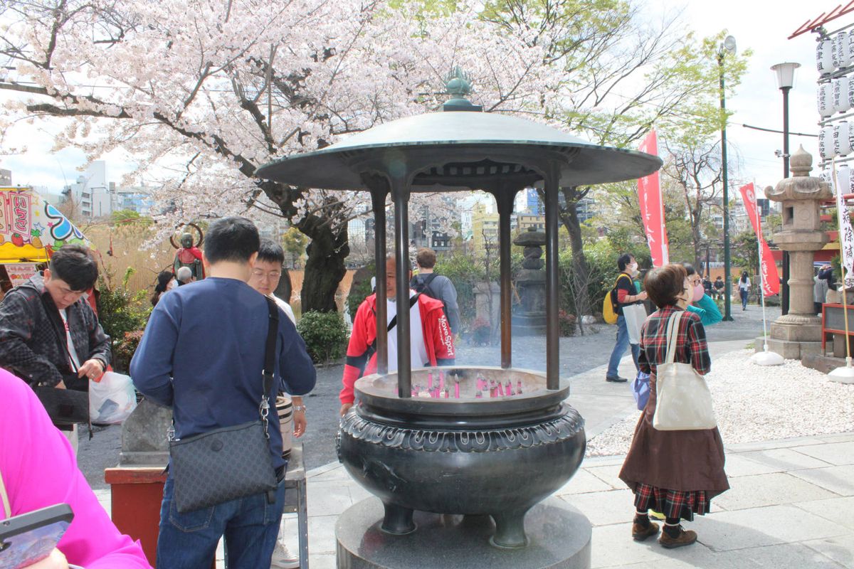 People at an incense burner