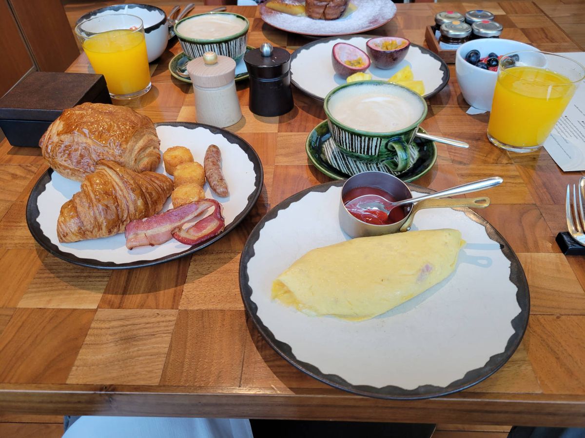 Breakfast: pastries, an omelet and juice