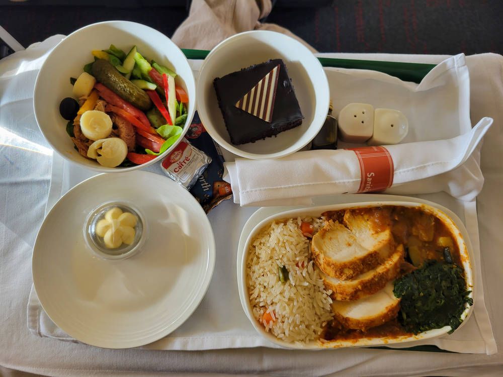 Chicken with rice, a salad and chocolate cake