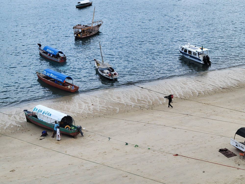 Boats pulled up on the sand